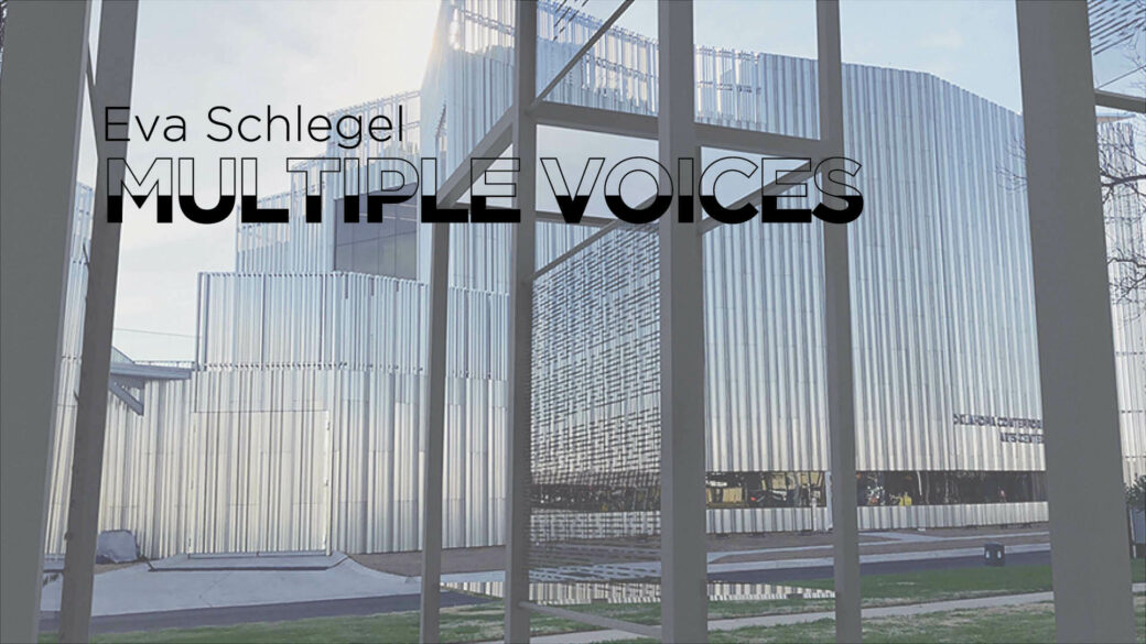 A metal structure with glass panels stands outside of a large angular metal building. The words EVA SCHLEGEL MULTIPLE VOICES appear in a black and transparent font across the top left corner of the image.