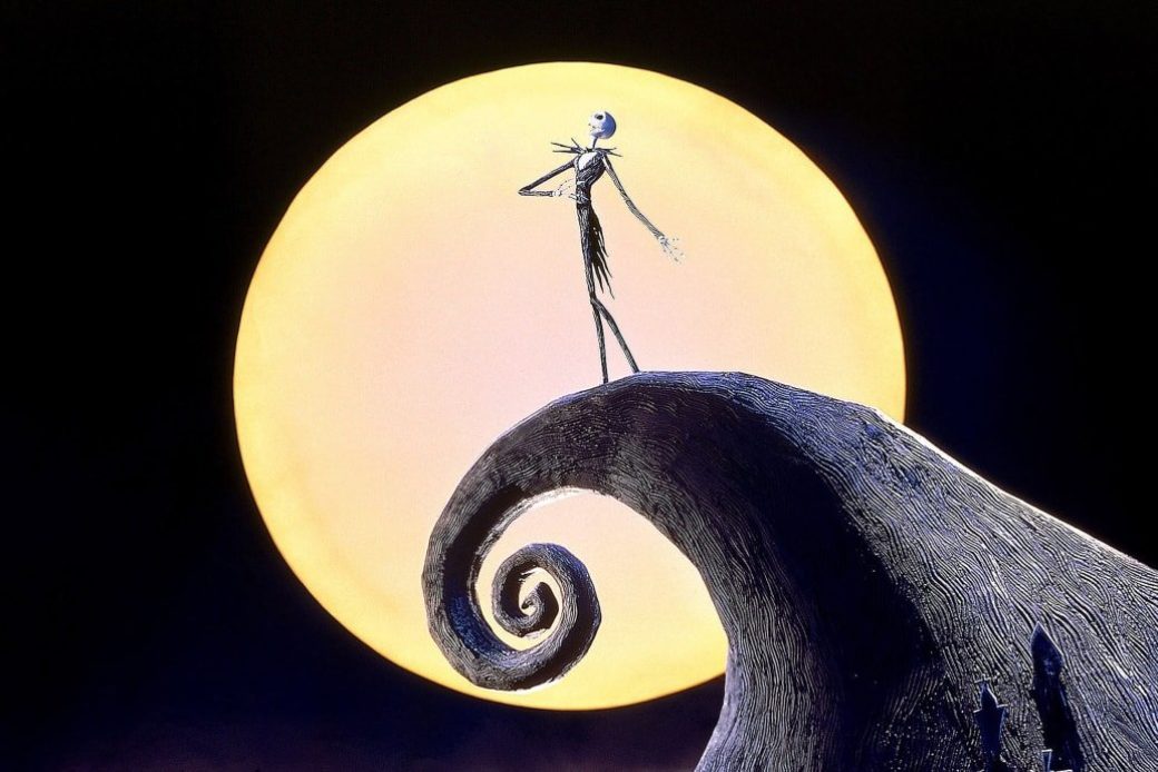 An image from the film The Nightmare Before Christmas depicts a claymation character set against a full moon