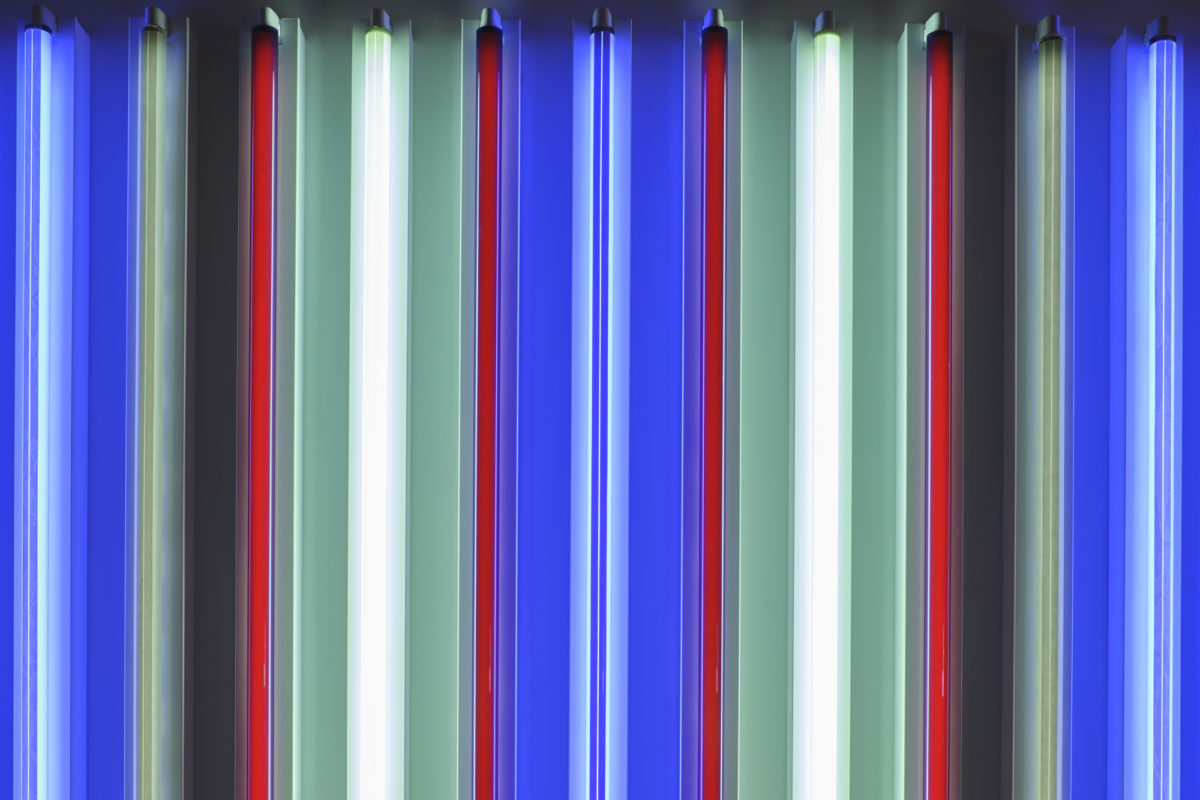 A close-up detail photo of multi-colored fluorescent tubes of light