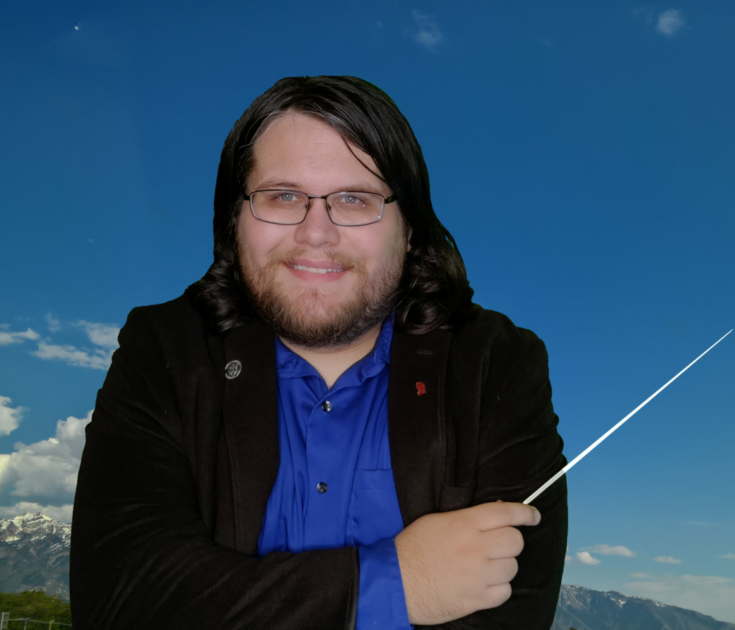 Man wearing glasses and holding a conducting baton smiles against a blue sky backdrop