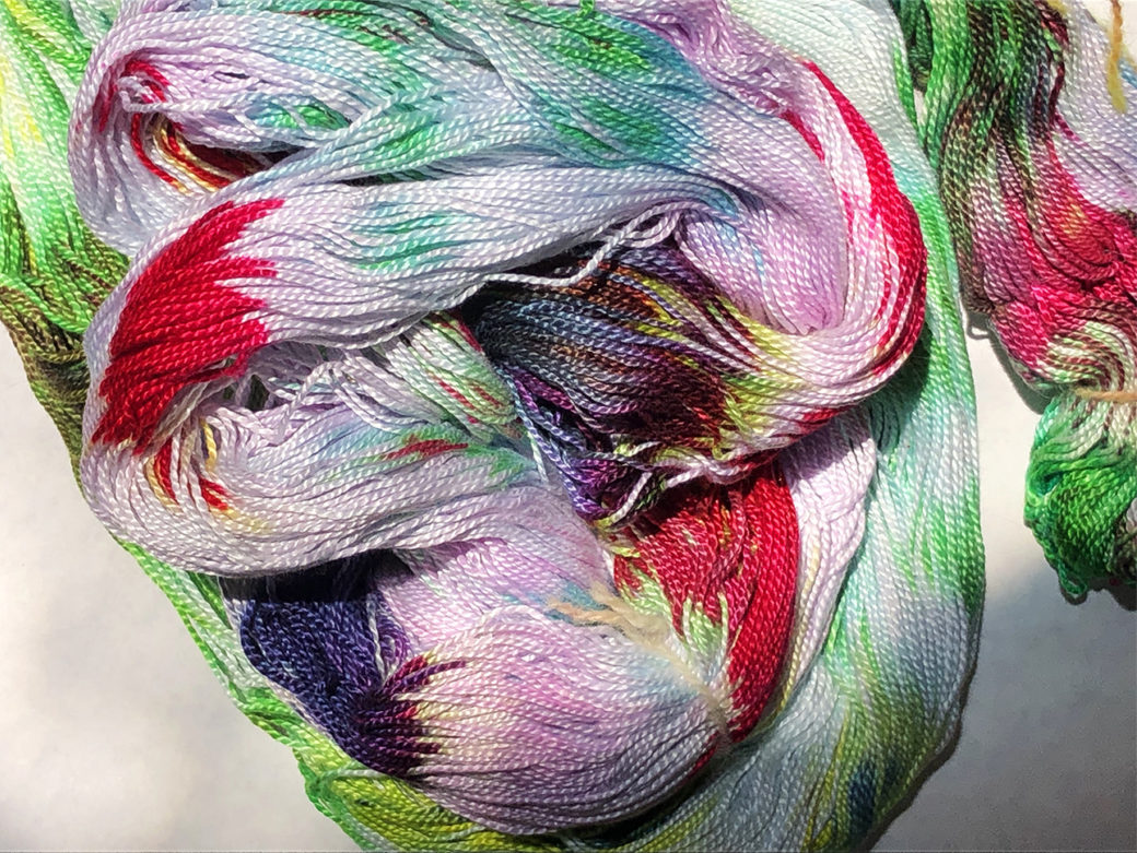 Skeins of yarn dyed in vibrant colors