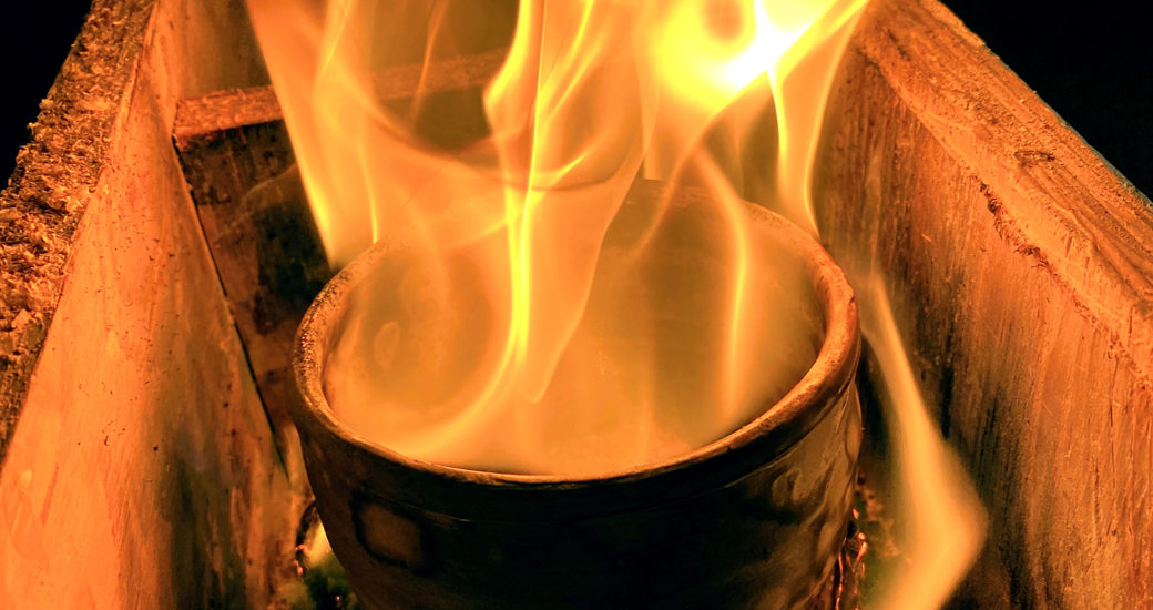 Image of a fire blazing over the top of a barrel