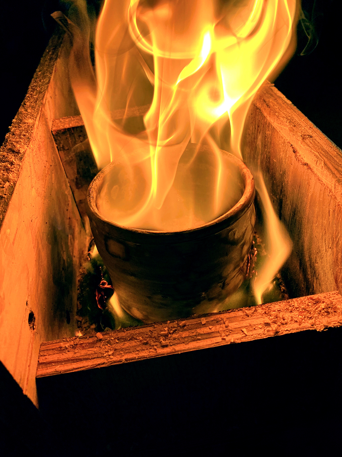 A ceramic bowl being fired using the raku technique
