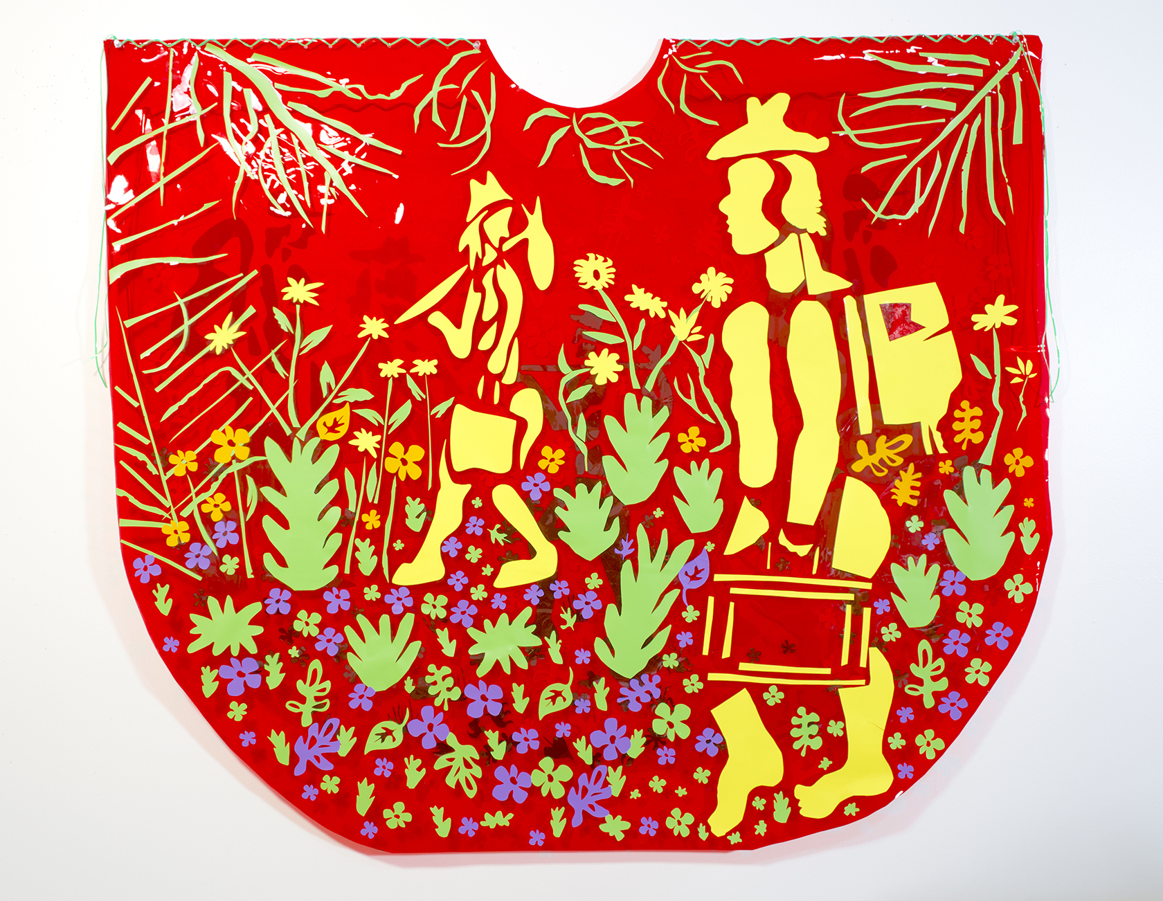 A 2-D mixed-media sculpture features a red background with woodcut-style images of yellow figures walking amid flowers and plants