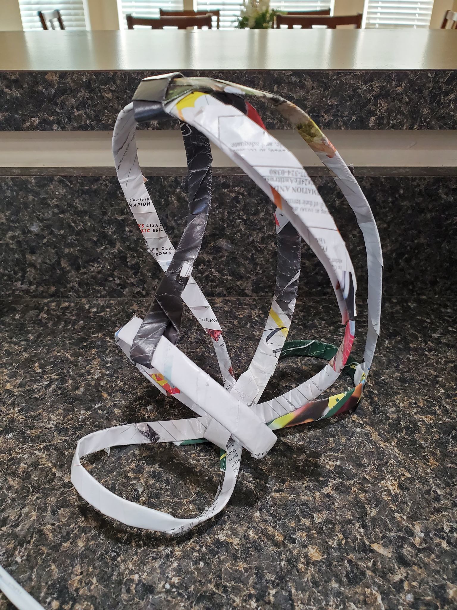 An abstract mixed media sculpture in progress, also featuring large overlapping coils, but with less finished detail than the image above