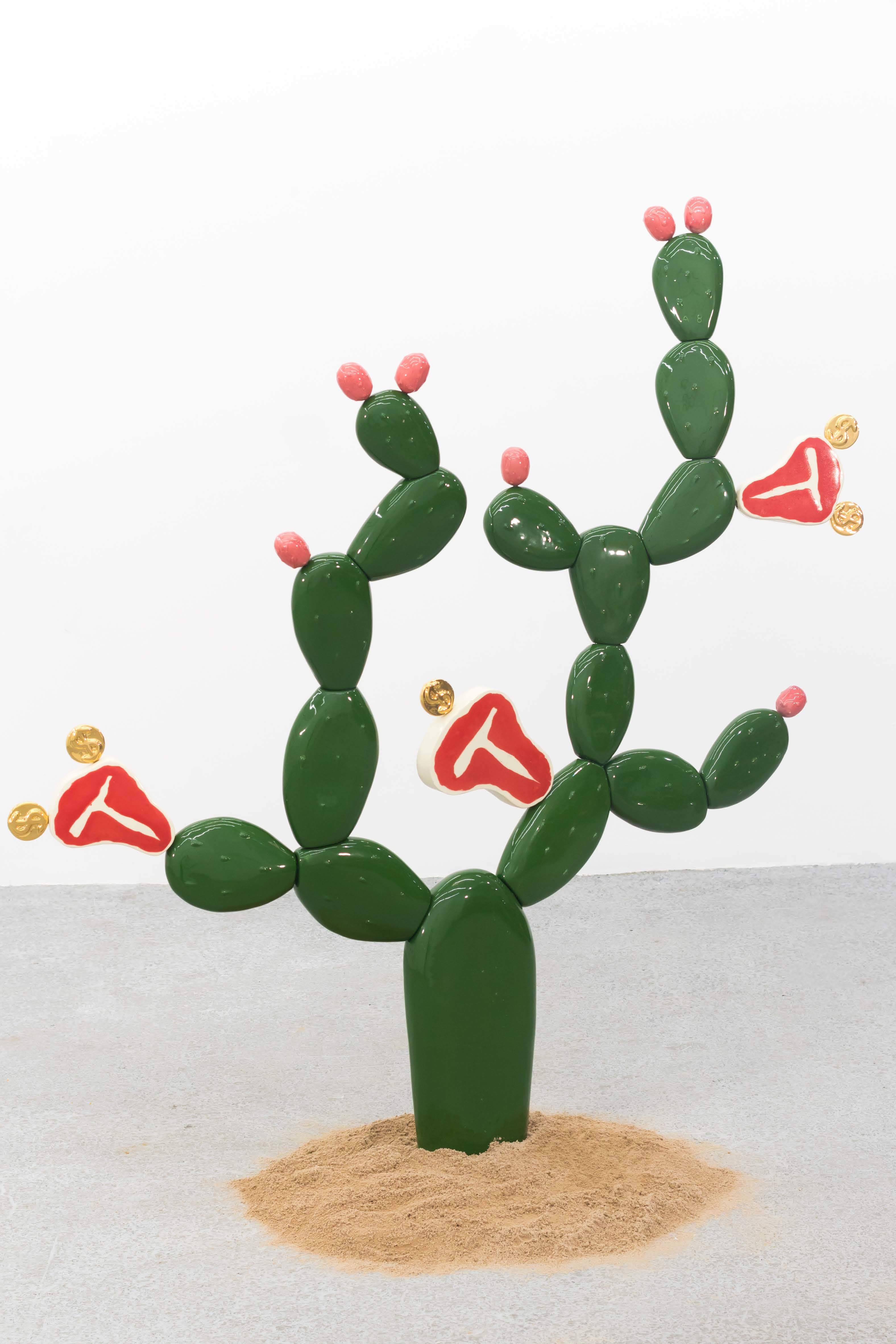 A green cactus sculpture with T-bone steaks as flowers