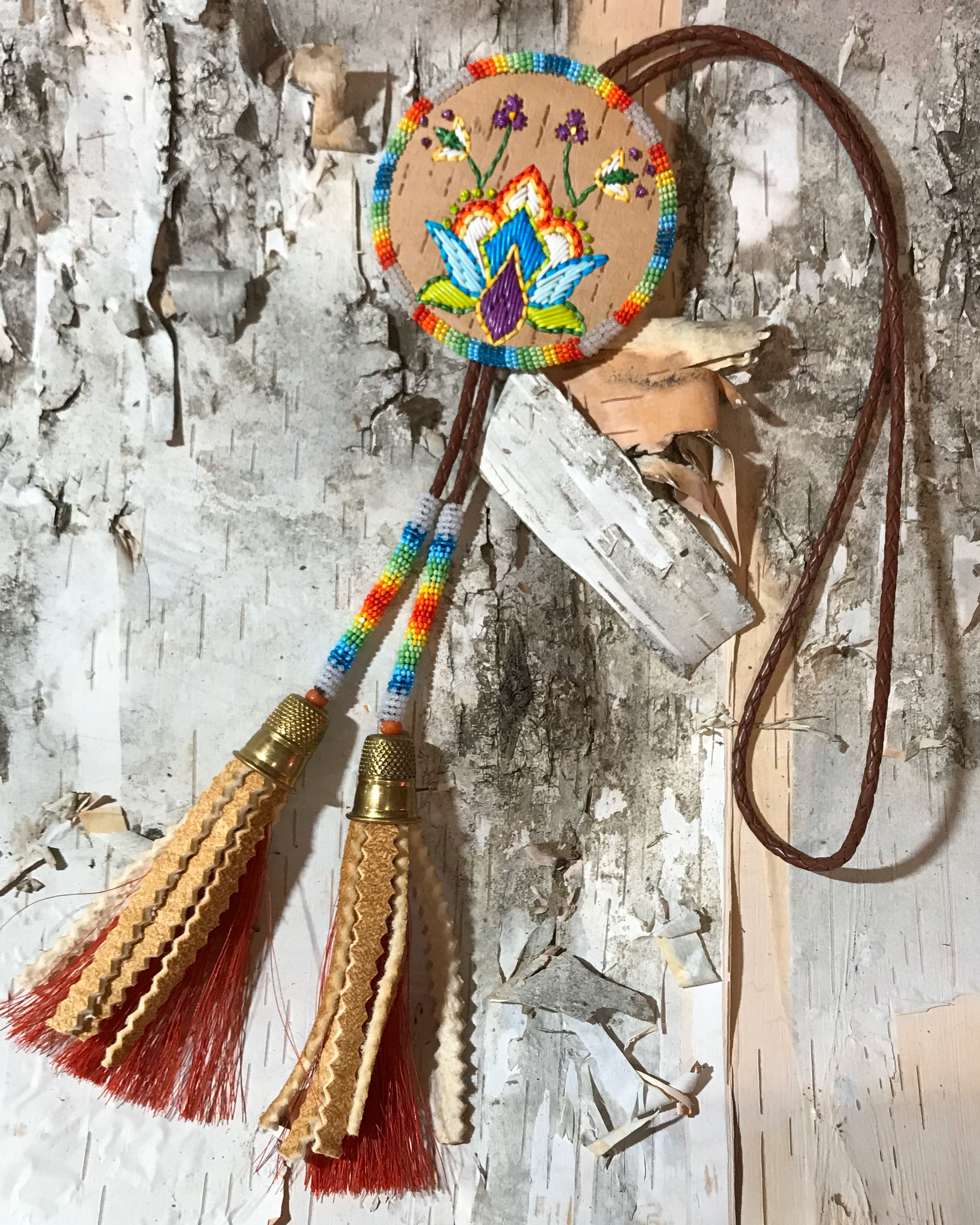 Handmade, embroidered, beaded accessory made by woodland quillwork