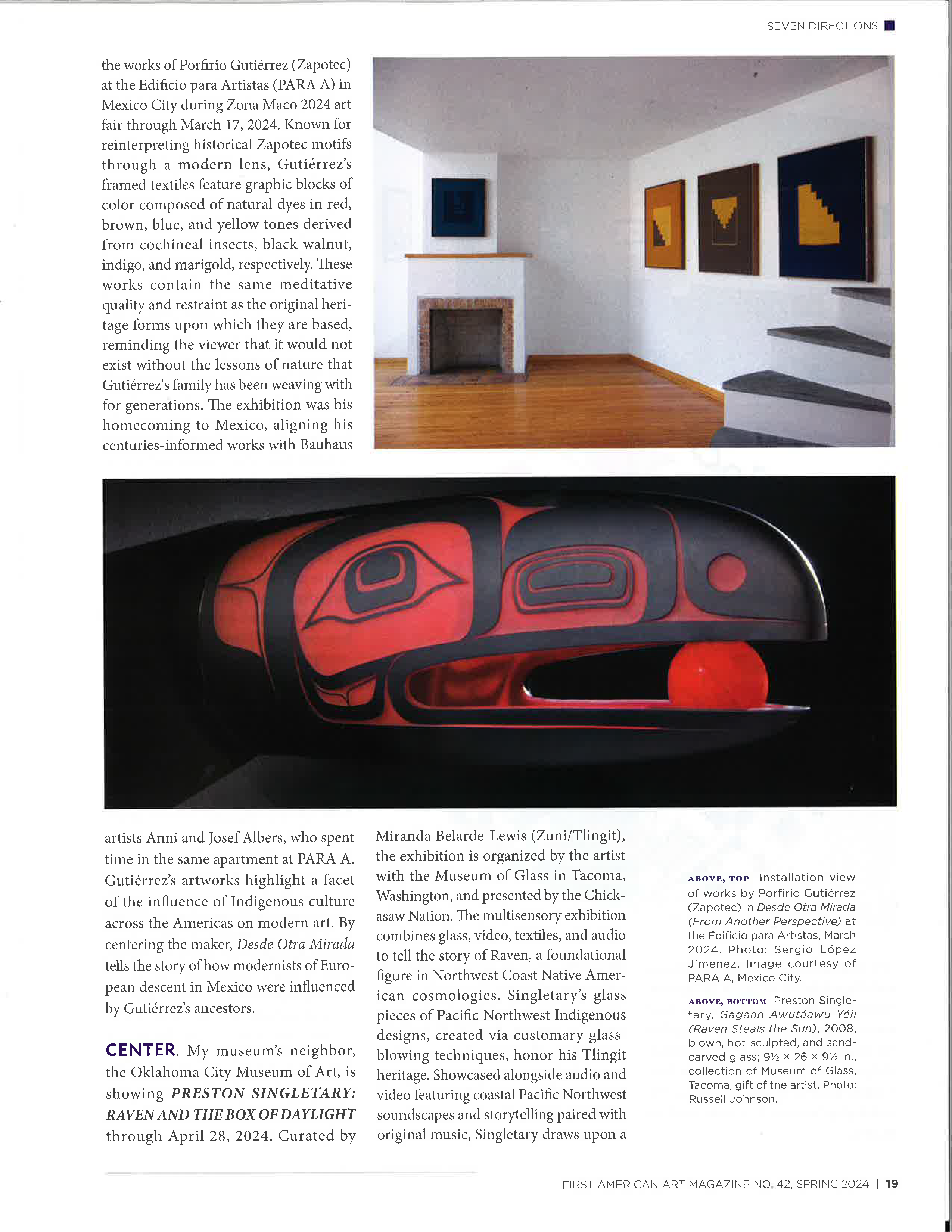 A magazine article with photos of geometric works in neutral tones displayed in a living room-like space and a red and black glass sculpture of a stylized raven with a red ball in its beak