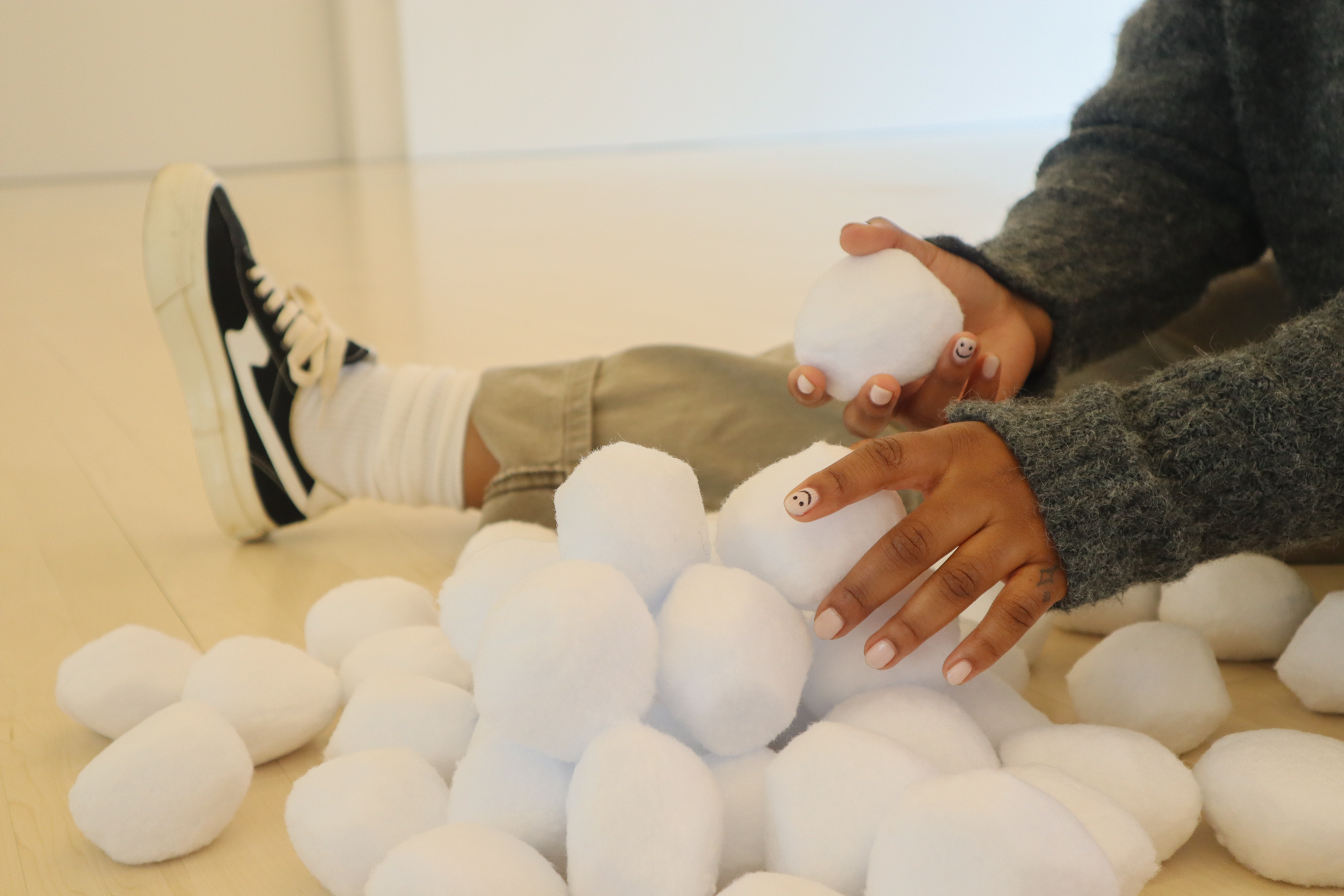 Hands grab for cotton snow balls