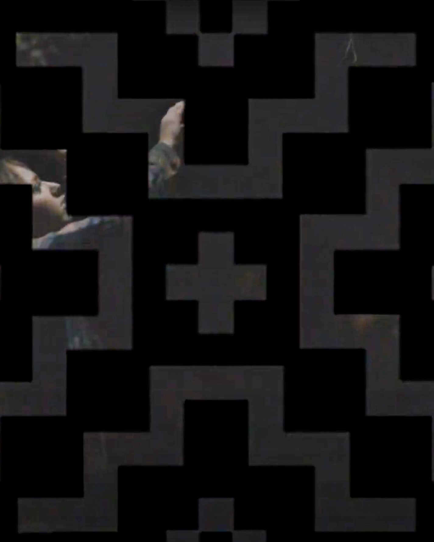 Geometric shapes form a grid-like mask across a photo of someone reaching up toward a tree. The image is dark. The shapes are black.