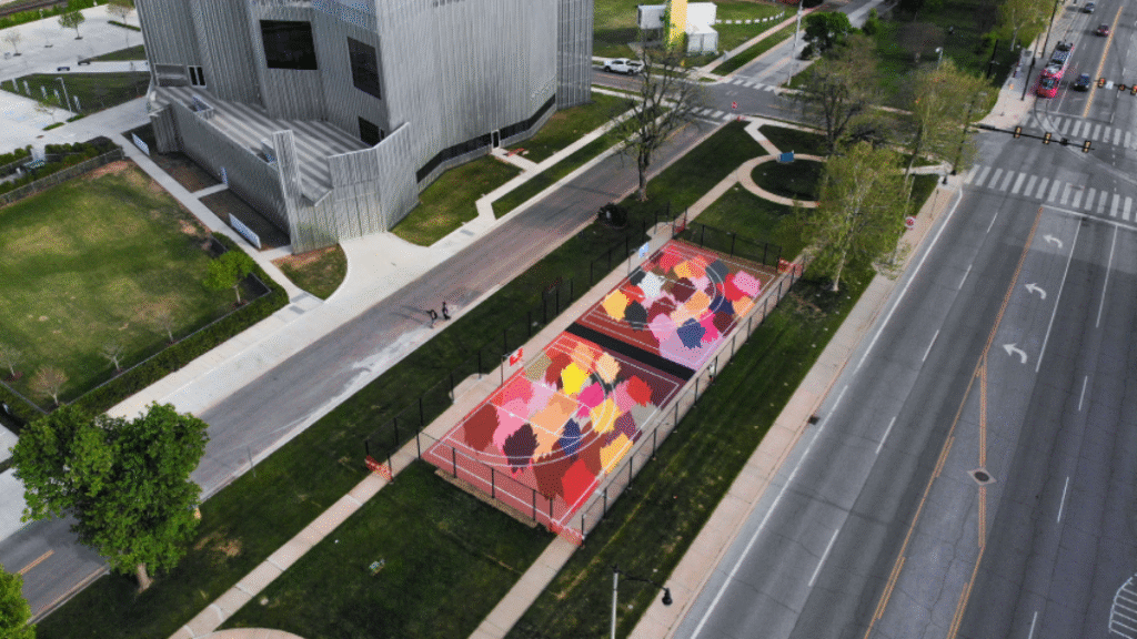 Two half-size basketball courts painted in bright, abstract designs