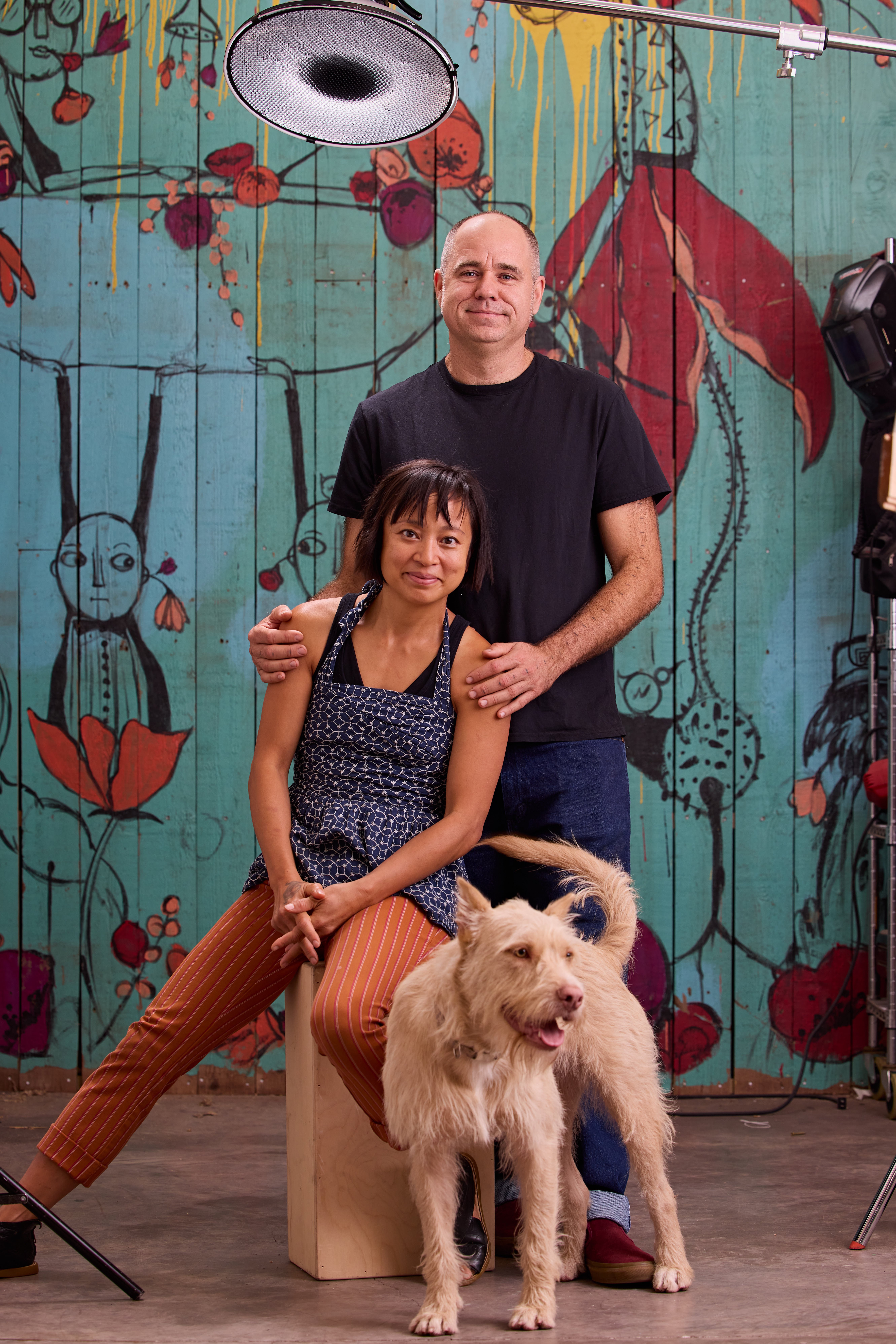 Artists Denise Duong and Gabriel Friedman pose in their studio along with dog Noodles