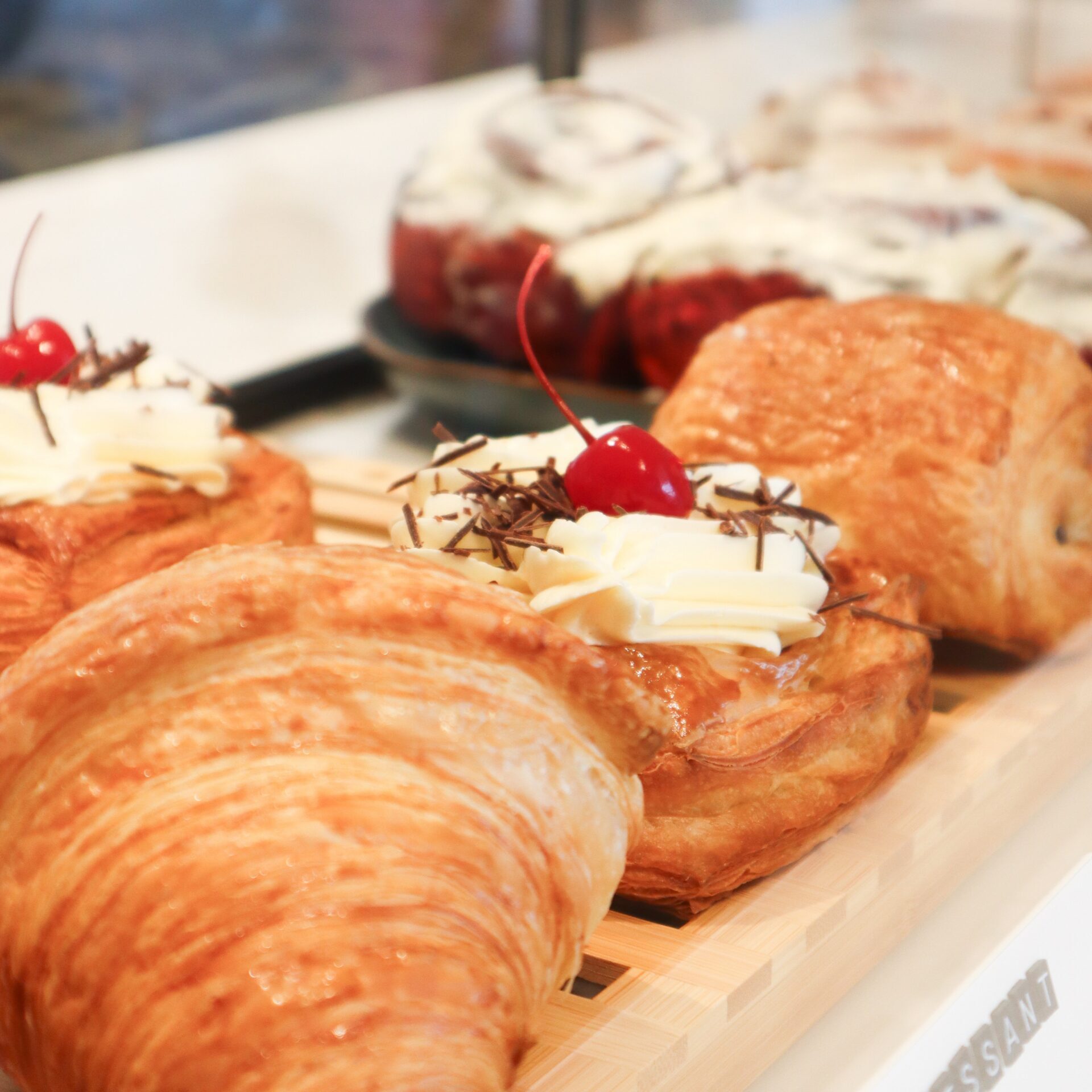 Close-up of various pastries in a display case