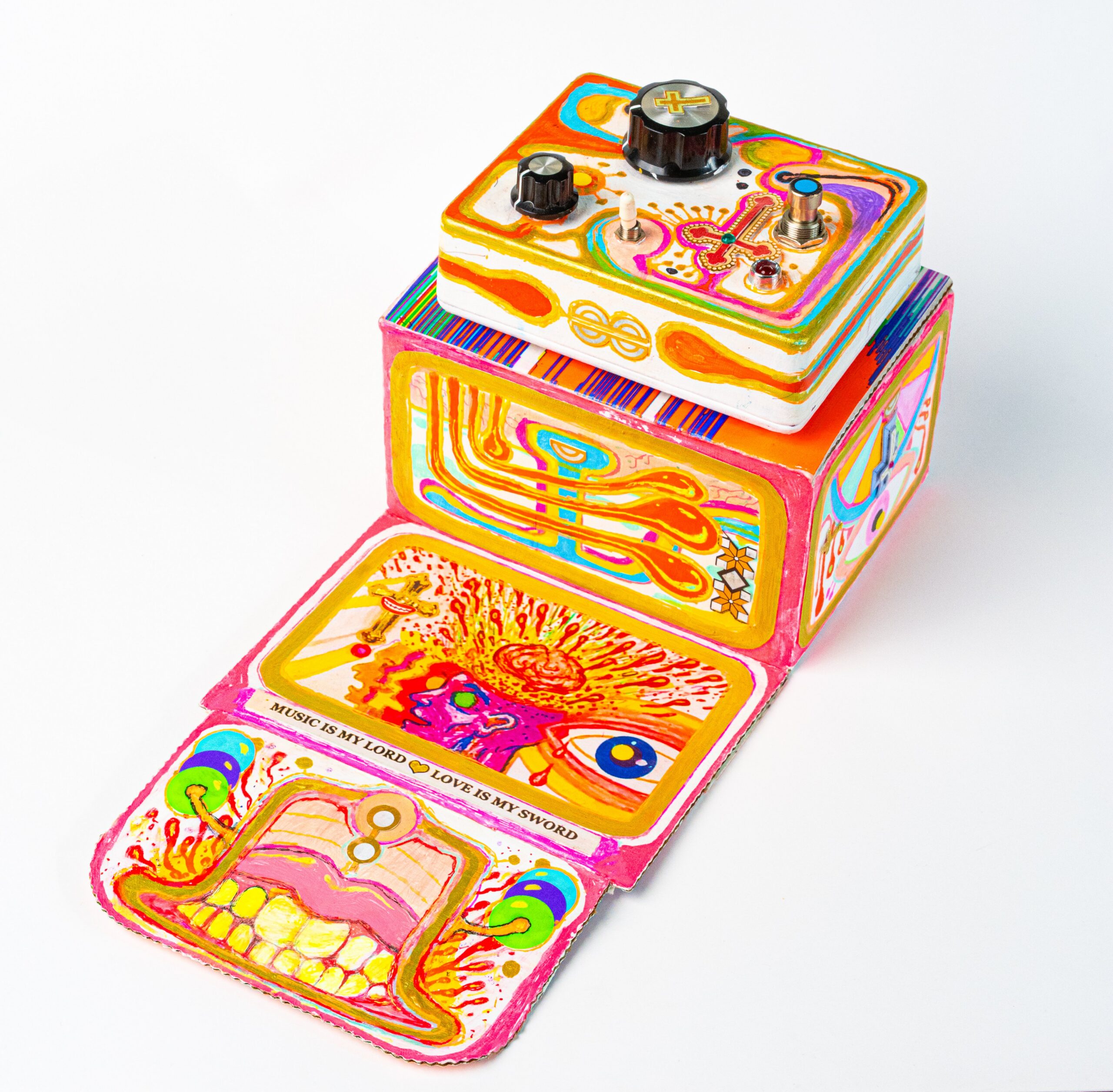 A guitar pedal with bright, psychedelic artwork